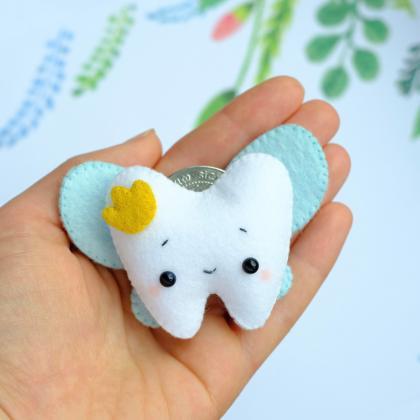 Tooth fairy with a tooth pillow fel..
